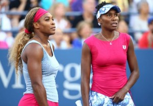 NEW YORK, NY - AUGUST 28: Serena Williams (L) and Venus Williams of the United States play their women's doubles match against Timea Babos of Hungary Kristina Mladenovic of France on Day Four of the 2014 US Open at the USTA Billie Jean King National Tennis Center on August 28, 2014 in the Flushing neighborhood of the Queens borough of New York City. Streeter Lecka/Getty Images/AFP